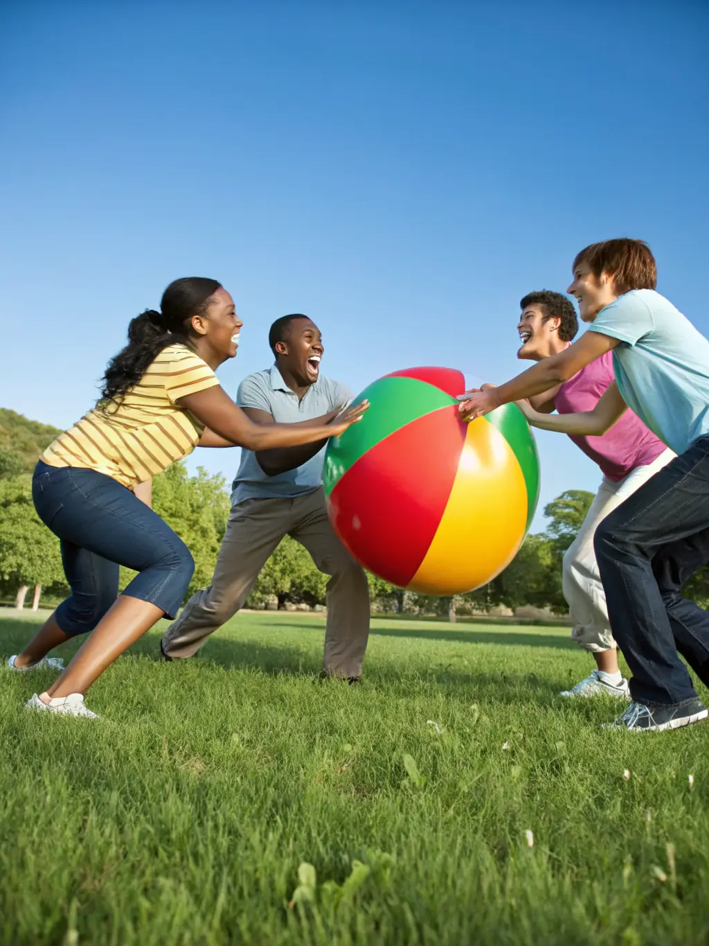 A group of USU sports club members participating in a team-building exercise outdoors, showcasing camaraderie and collaboration.